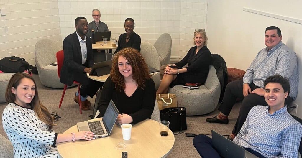 81qd About Us Team In Office Setting
